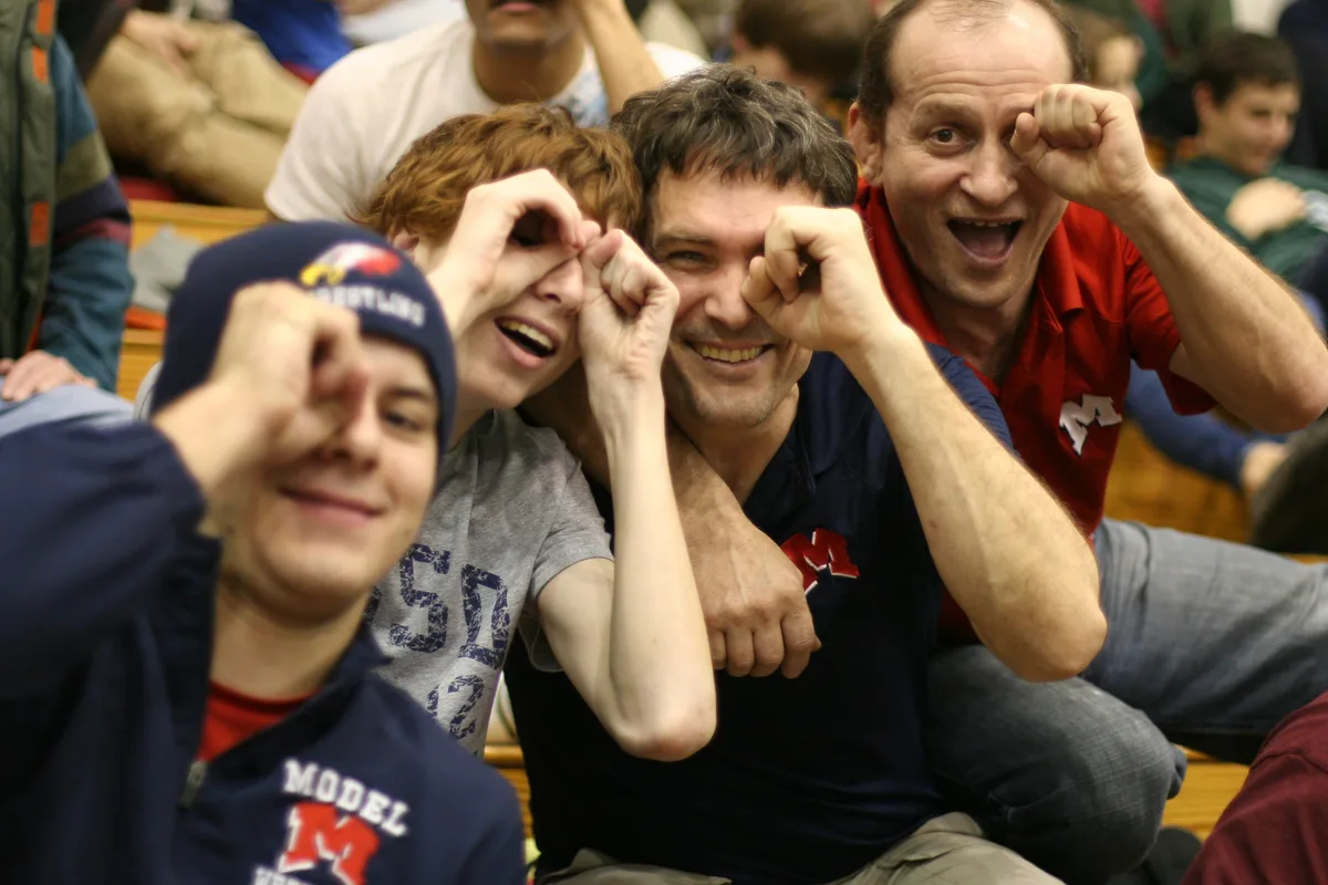 Wrestlers Albert and Ilan with coaches Thad and Tairbek making funny faces