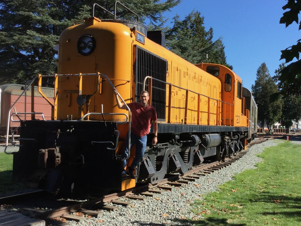 Thad standing on the RSD-4 locomotive at the Northwest Railway Museum