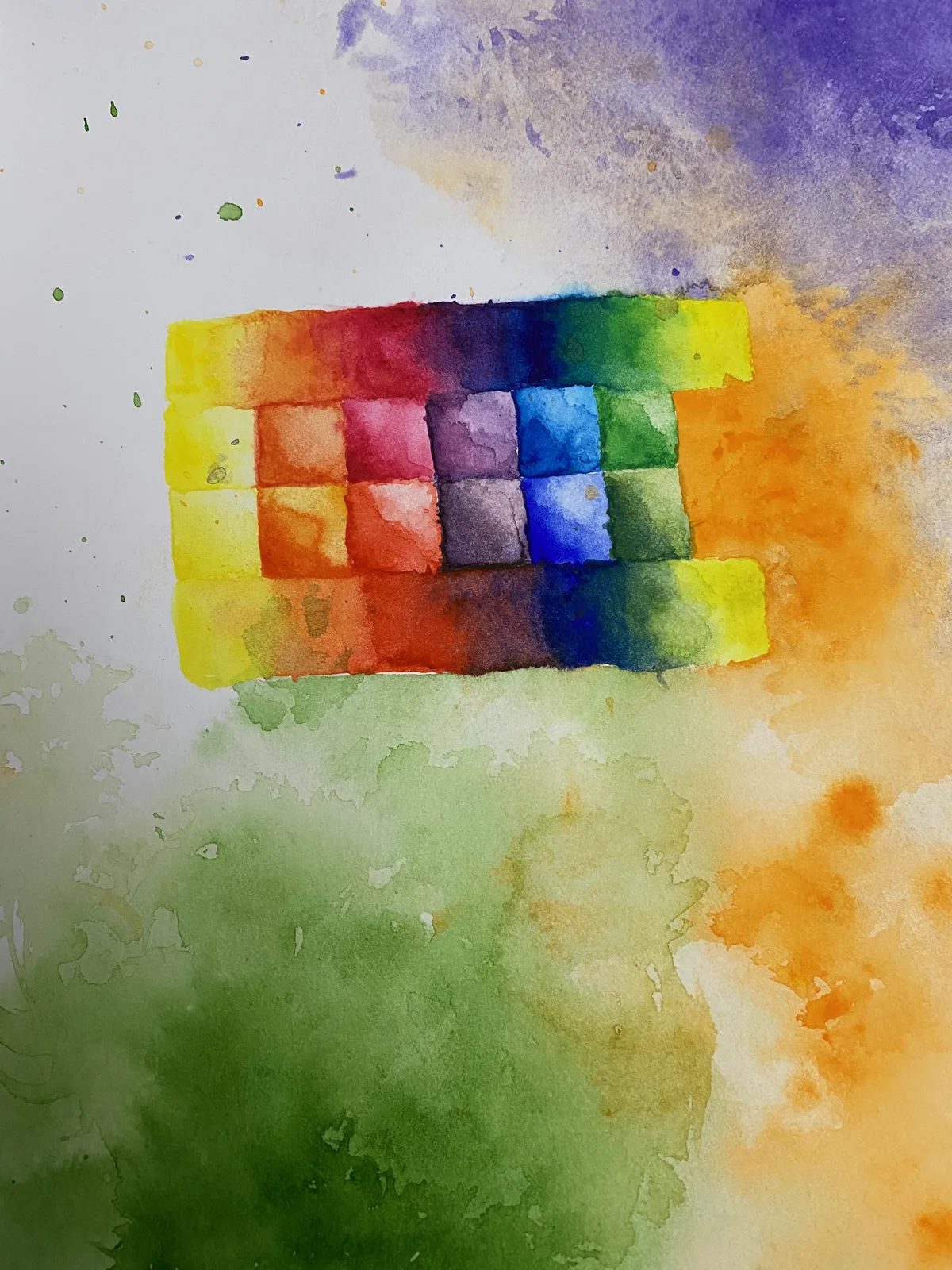 Watercolor color-mixing grid using six pigments, with loose washes of purple, orange, and green bleeding around it on paper.