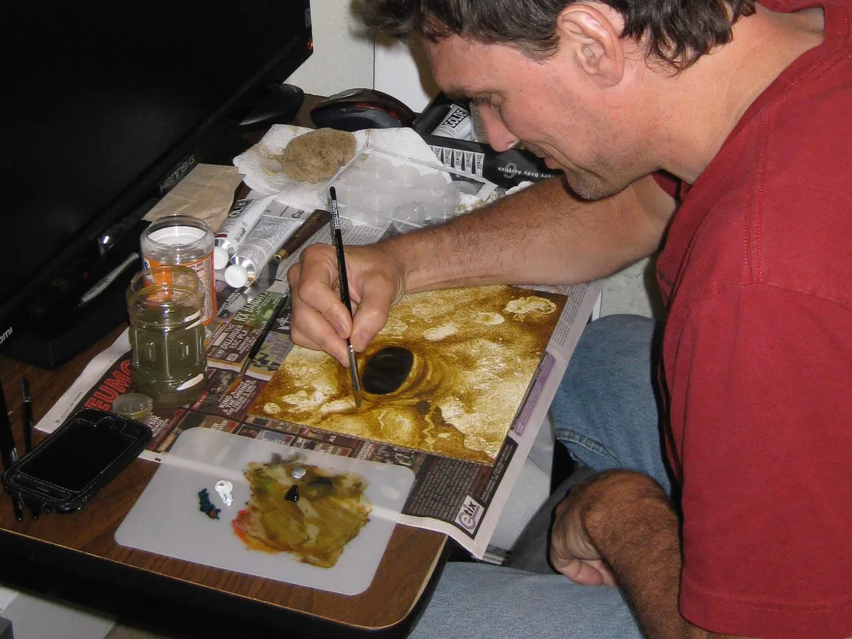 Thad painting the early background texture around the eye for Elder's Eye.