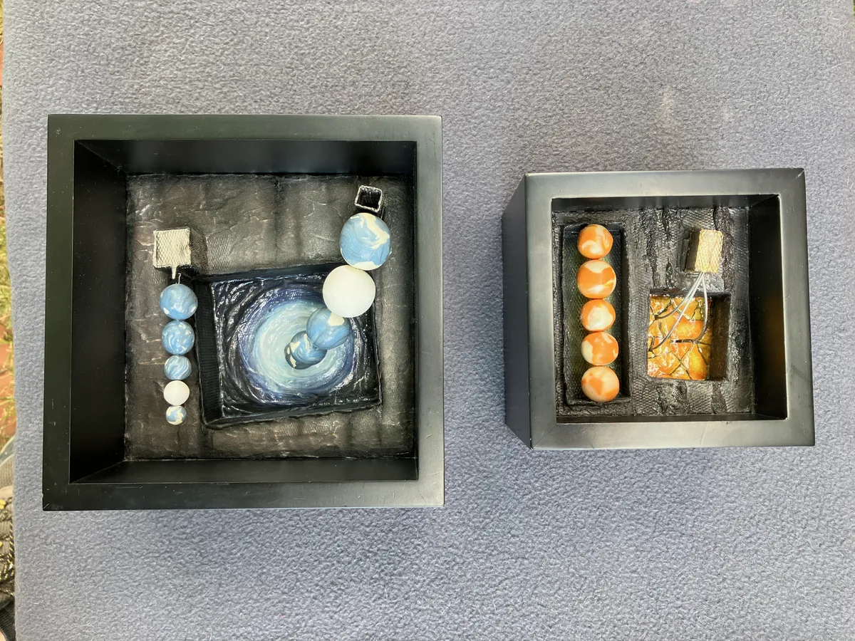 Subconscious at Work I and II shown side by side, one blue and one orange.