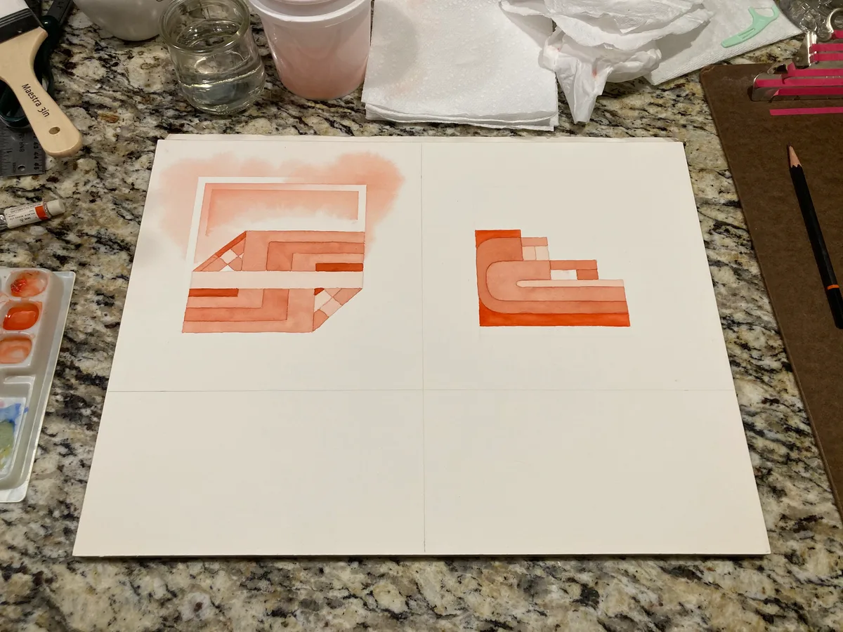 Two vermilion watercolor paintings in progress on a work surface